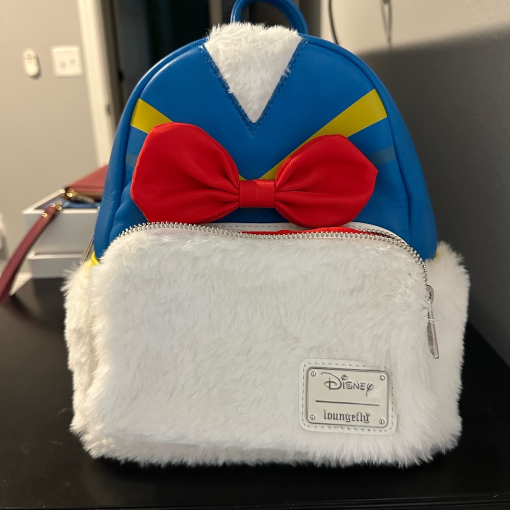 Loungefly Disney Blue and White Backpack with Red Bow